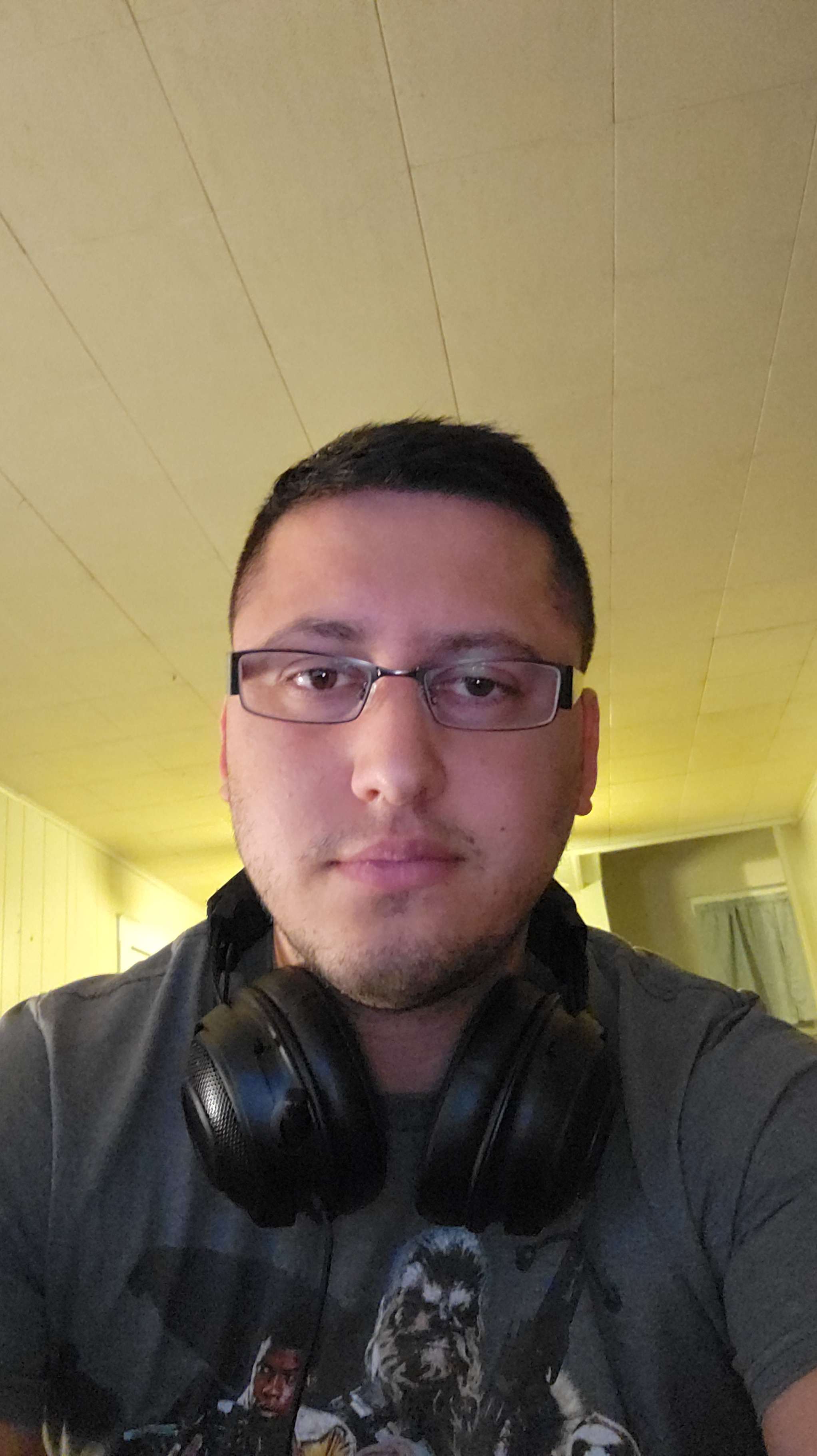 Photo of Xavier Garner wearing headphones.